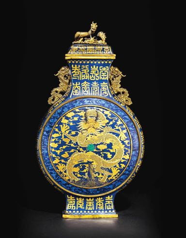 A  gold and silver decorated blue enamel ground moon flask and cover, 1736-1795, courtesy Christie’s