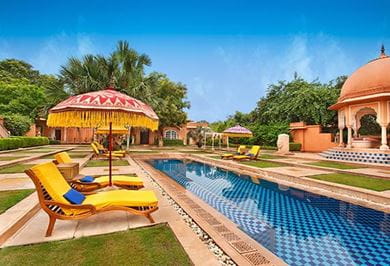 Poolside view of the Kohinoor Villa at The Oberoi Rajvilās, Jaipur