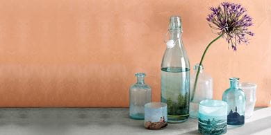 Give party supplies a homely touch with printed decals wrapped around pale glass bottles