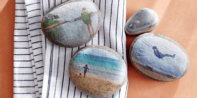 Create and use decoupaged rocks to weight down napkins and tablecloths on breezy days