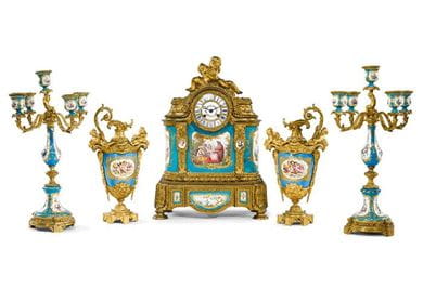 An associated Louis XVI style gilt bronze and Sèvres style ceramic five piece clock garniture, Paris, 1895. Courtesy, Sotheby’s 
