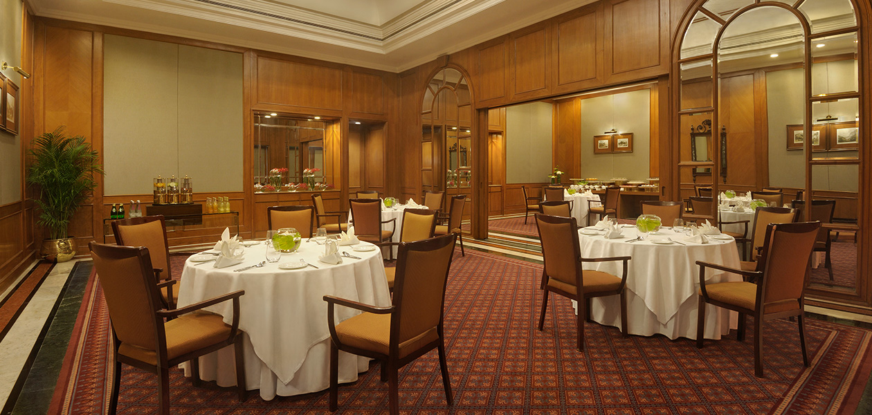 Elegant dining room setup at The Oberoi Bengaluru hotel.