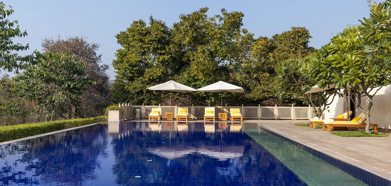 Luxurious poolside at The Oberoi Sukhvilas, a 5-star resort