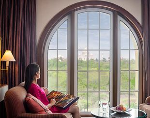 Elegant lounge area in the Kohinoor Suite at The Oberoi Amarvilas, Agra with refined Mughal-style interiors.