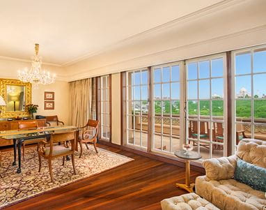 Luxury Suite living room at The Oberoi Amarvilas, Agra – stylish interiors with fine furnishings and views of the gardens.