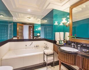  Spacious bathroom in the Premier Room with Balcony at The Oberoi Amarvilas, Agra with elegant marble interiors.