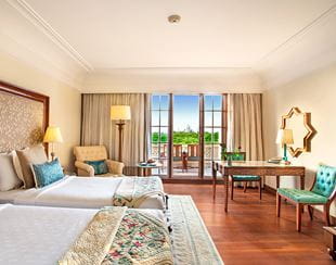 Twin-bedded layout in the Premier Room with Balcony at The Oberoi Amarvilas, Agra for comfortable shared stays.