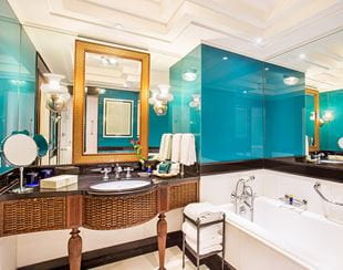  Premier Room bathroom at The Oberoi Amarvilas, Agra with marble fittings and a standalone bathtub.