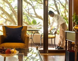Luxurious suite at The Oberoi Bengaluru with balcony view.