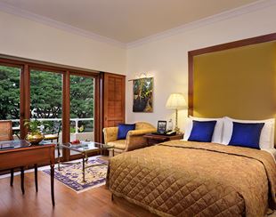 Luxurious bedroom at 5-star Hotel The Oberoi Bengaluru.