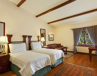 Elegant twin bedroom at The Oberoi Cecil, a 5-star hotel in Shimla