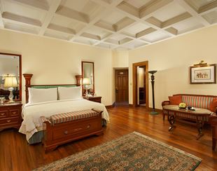 Luxurious bedroom with elegant furniture in The Oberoi Cecil, Shimla