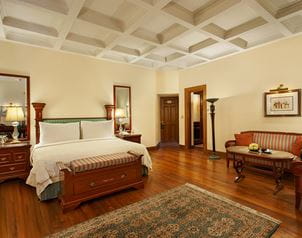 Luxurious bedroom with elegant furniture in The Oberoi Cecil, Shimla