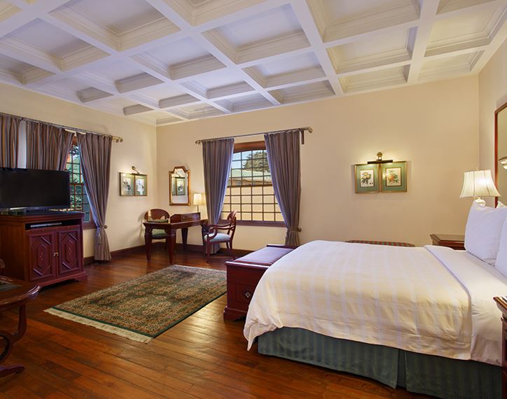 Elegant bedroom in luxury hotel, The Oberoi Cecil, Shimla, with decor