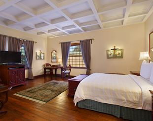 Elegant bedroom in luxury hotel, The Oberoi Cecil, Shimla, with decor