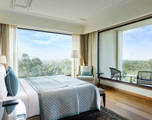 Luxurious room in The Oberoi New Delhi overlooks lush greenery