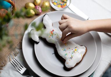 Hand decorates bunny-shaped cake at The Oberoi Sukhvilas Resort.
