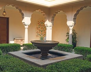 Elegant courtyard fountain at The Oberoi Sukhvilas, Siswan Forest Resort.