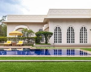 Luxurious poolside at The Oberoi Sukhvilas, Siswan Forest Resort, serene setting