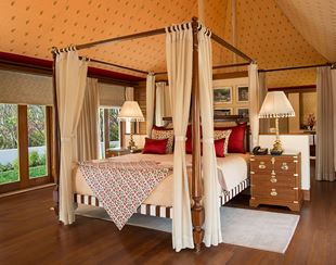 Luxurious bedroom with canopy bed in The Oberoi Sukhvilas resort