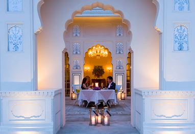 A couple dining at The Oberoi Sukhvilas resort courtyard