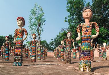 Colorful sculptures standing in a garden near the Siswan forest resort