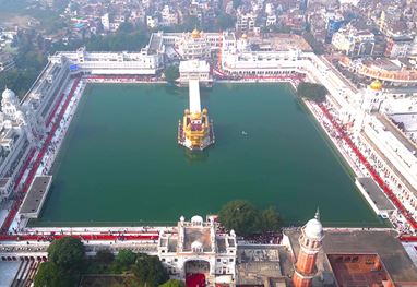 Aerial view of Golden Temple with surrounding complex and cityscape