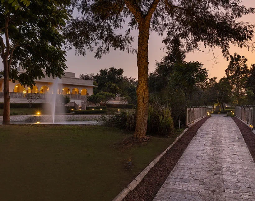 Pathway and fountain at sunset, The Oberoi Sukhvilas Resort, Siswan Forest