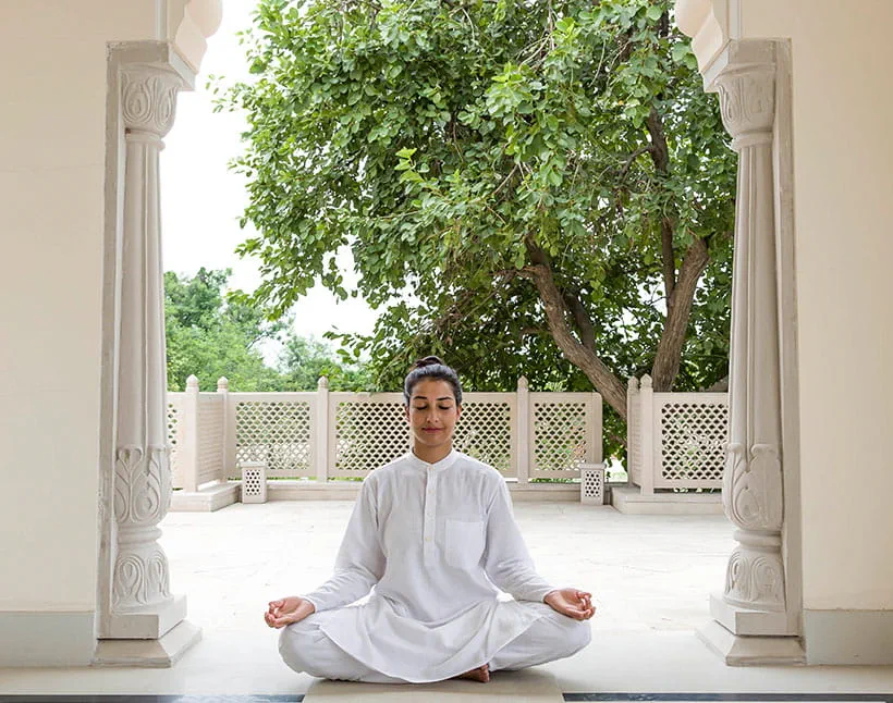 Yoga meditation at The Oberoi Sukhvilas, Siswan Forest Resort balcony