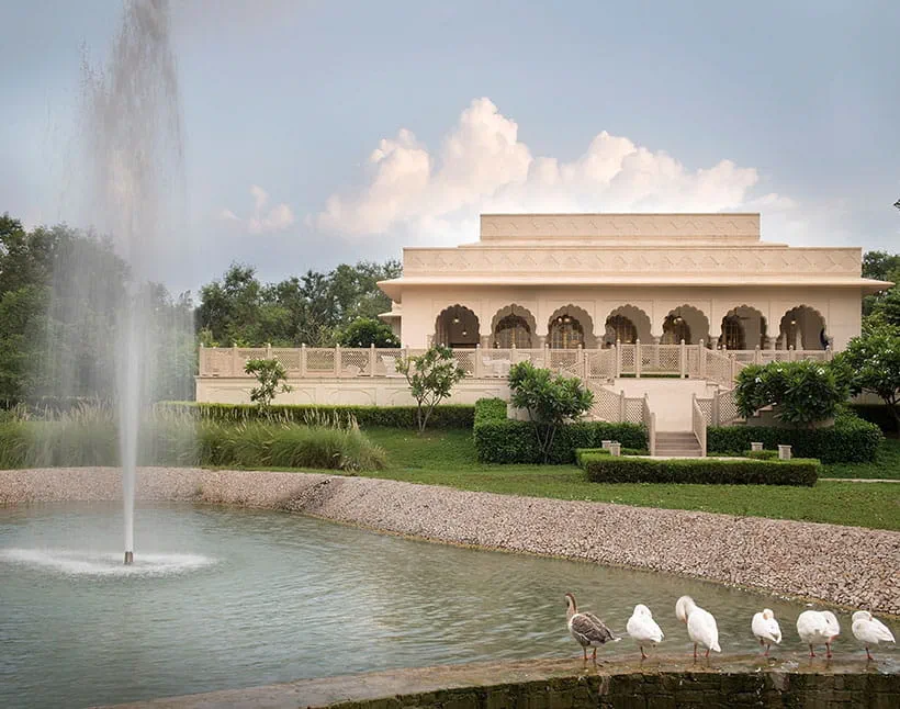 Elegant building with fountain at The Oberoi Sukhvilas Luxury Resort