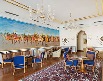 Luxury lounge at The Oberoi Sukhvilas Siswan Forest Resort with mural