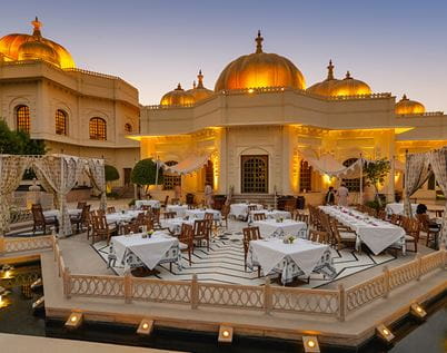 Alfresco seating at Suryamahal & Chandni with views of the courtyard, offering an unforgettable experience at The Oberoi Udaivilas, luxury resort in Udaipur