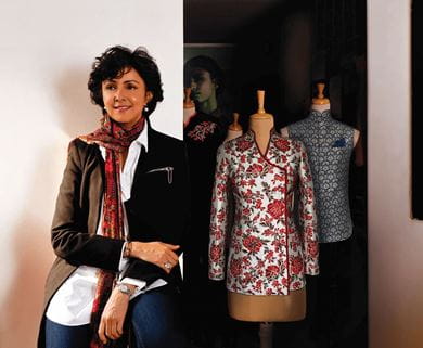 Designer Payal Jain poses next to a mannequin donning the new uniform at The Oberoi, New Delhi
