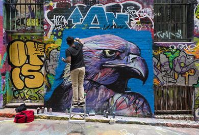 Artist working on a graffiti in Melbourne, Australia