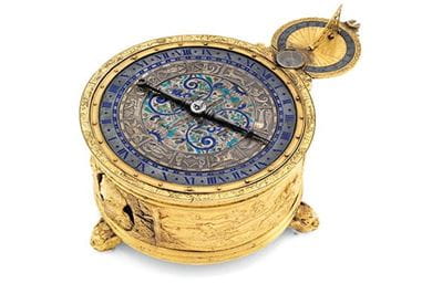 A gilt-brass circular horizontal table clock case circa 1580