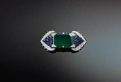 Brooch set with emeralds, sapphires and diamonds, 1922, Cartier, Paris. Copyright Servette Overseas Ltd 2014