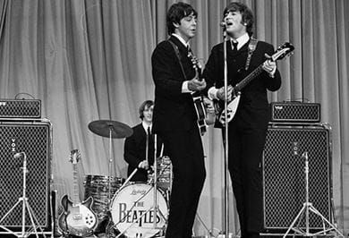 Paul McCartney on bass and John Lennon on guitar at the Sports Palace of Paris 