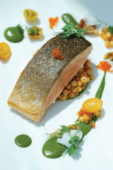 Salmon with spinach and moghrabia, served at Aquario