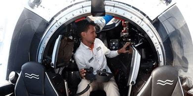 A crew member sits in the cockpit of a C-Explorer 3 submarine during the Monaco Yacht Show in Post Hercules, Monaco